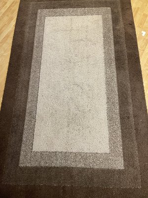 Photo of free 60 x 100 area rug tan/brown (Rockaway, NJ)