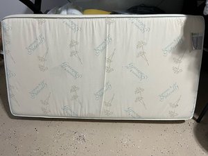 Photo of free Crib Mattress (Quebec St and 2nd Ave.)