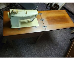 Photo of free Vintage Sewing machine with table (hyattsville, MD near Takoma pk)