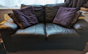 Photo of free Black (leather?) Two seater sofa (Morecambe LA4)