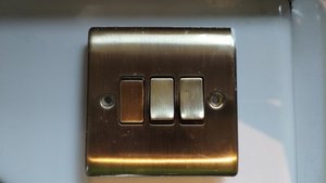 Photo of free 3 gang antique brass light switch (Heaton Chapel SK4)