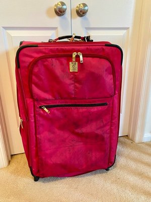 Photo of free Large pink suitcase (South Reston)