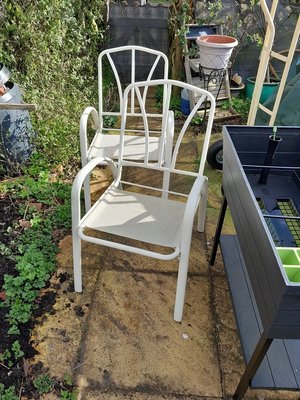 Photo of free 2 white garden chairs (Bridgnorth High Town WV16)