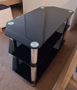 Photo of free Black glass TV stand (Teignmouth TQ14)