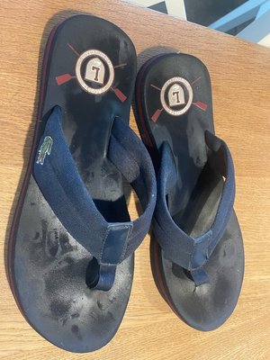 Photo of free Lacoste men’s flip flops size 10 (Sherwood NG5)