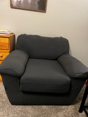 Photo of free Faux leather chair w/grey slipcover (Columbus, NC)