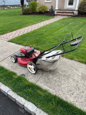 Photo of free Lawn mower curb pick up (Riverdale)