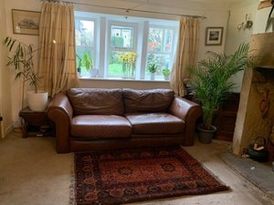 Photo of free Tan Leather Settee with fire regs label (Oldfield HD9)