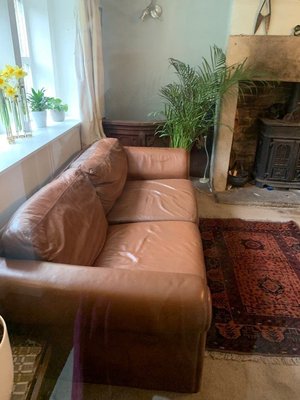 Photo of free Tan Leather Settee with fire regs label (Oldfield HD9)