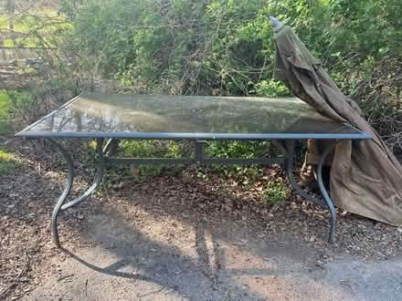 Photo of free Outdoor Glass table (Beulah rd and Druid hill rd NE) #1