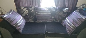 Photo of free 2 seater leather couch and Black fabric couch with cushions (Methil KY8)