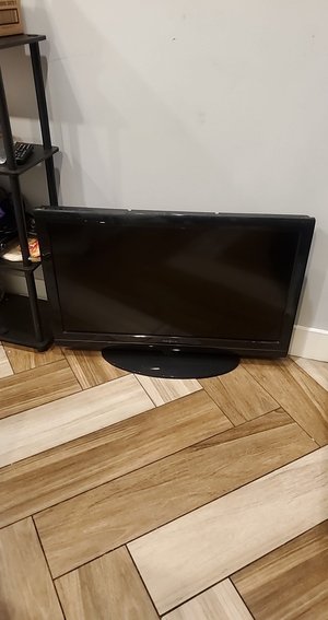 Photo of free TV with own stand - approx 42" (US19 & Nursery Road)