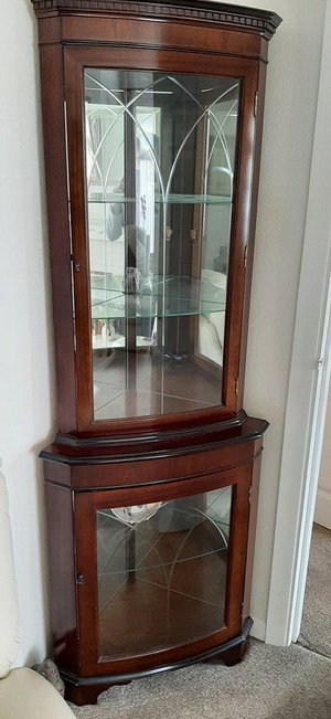 Photo of free Tall dark wood display cabinet (Leicester Forest East)