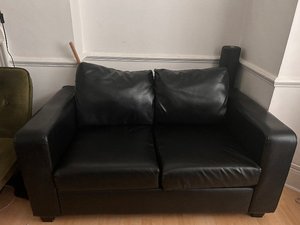 Photo of free 2 seater faux leather black sofa (Olympia W14)