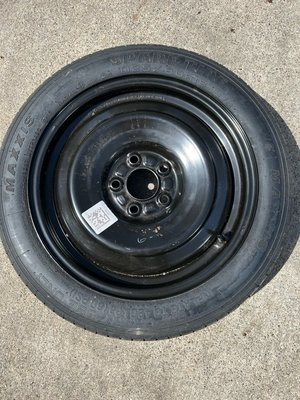 Photo of free Spare “doughnut” tire (Farmington and Eleven Mile Rds)