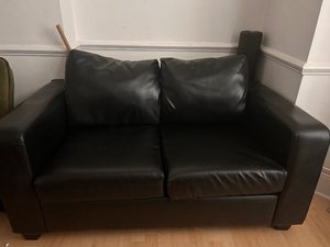 Photo of free 2 seater faux leather black sofa (Olympia W14)