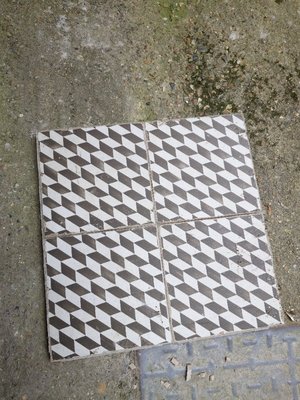 Photo of free 6 medium sized tiles with black & white geometric design (Battersea SW11)