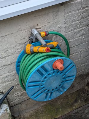 Photo of free Wall mounted hose reel with hose and gun (CT10)