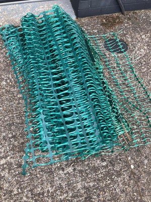 Photo of free Green plastic fence with stakes (GU24 Bisley)