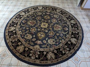 Photo of free 8' round area rug (Lenni Rd near Rt 452)
