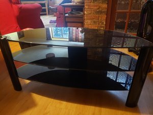 Photo of free Black glass TV stand (Forest Green)