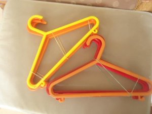 Photo of free Childrens hangers orange /yellow x 20 (Malvern Link WR14)