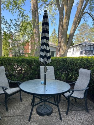 Photo of free 48” round patio table & umbrella (Highland Park, IL)