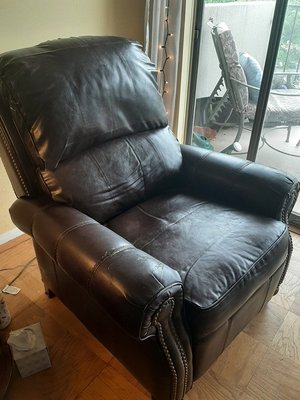 Photo of free Well-loved Faux leather recliner (Silver Spring)