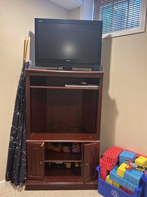 Photo of free Brown TV Stand/Cabinet (North Medford)