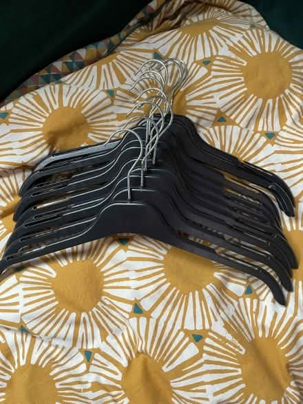 Photo of free 10x black unbranded clothes hangers (Two Waters HP3)