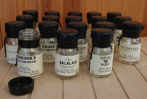 Photo of free 18 empty single dram whiskey bottles (Newton Hill WF1)