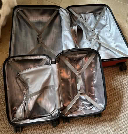 Photo of free Large and small matching suitcases (LU7)