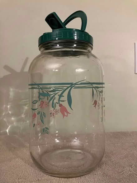 Photo of free 1-gallon glass jug with green lid (Near Gary Ave & Schick Rd)