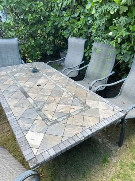 Photo of free Patio table and 4 chairs (Coral Gables)