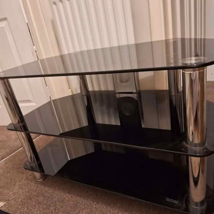 Photo of free Black glass TV Stand (Newton Hall DH1)