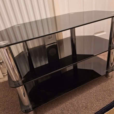 Photo of free Black glass TV Stand (Newton Hall DH1)