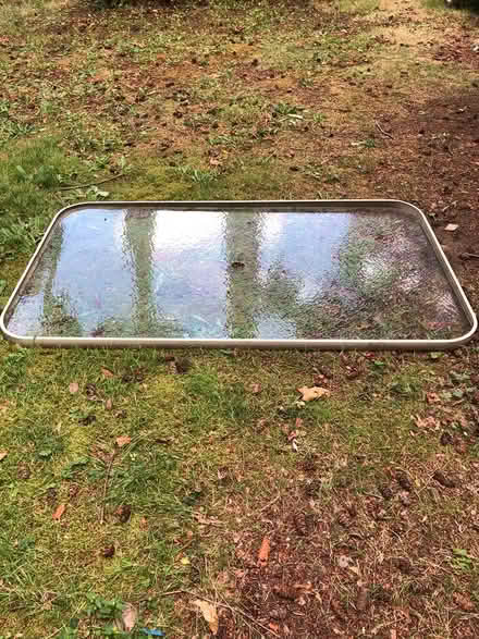 Photo of free Outdoor glass table top (no base) (Kenmore)