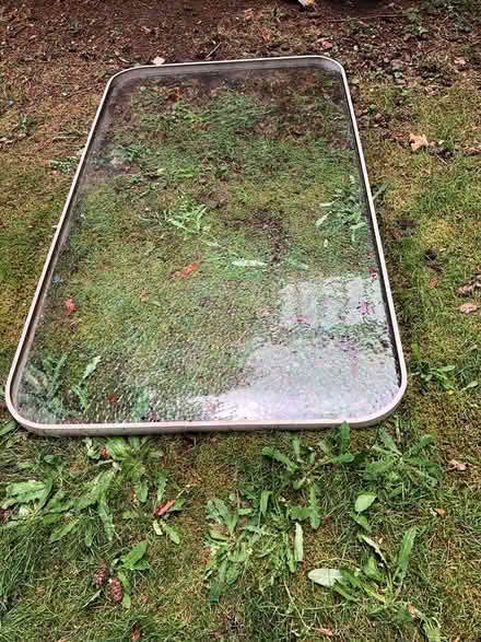 Photo of free Outdoor glass table top (no base) (Kenmore)