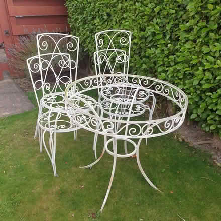 Photo of free Outdoor wrought iron table and 4 chairs (Llangwstenin LL29)