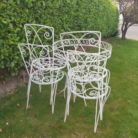 Photo of free Outdoor wrought iron table and 4 chairs (Llangwstenin LL29)