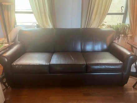 Photo of free Brown Faux-Leather Pullout Couch (60642) #1