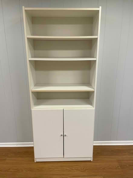 Photo of free Tall book shelf unit (West side) #1