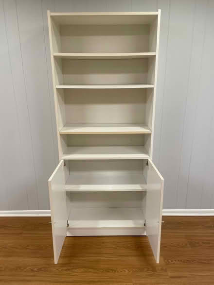 Photo of free Tall book shelf unit (West side) #2