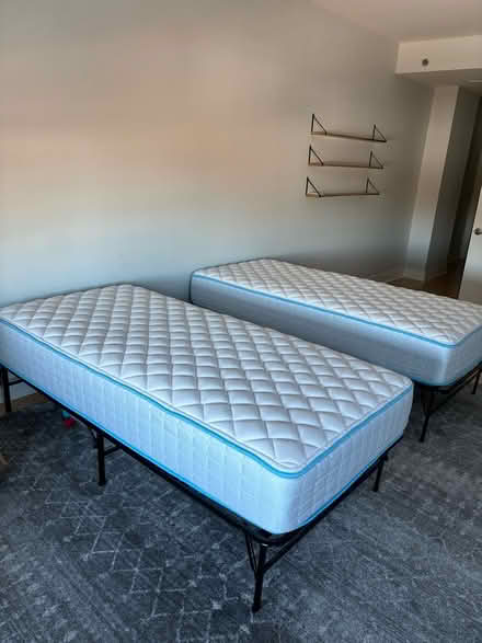 Photo of free Twin mattresses with frames (Harbor East) #1