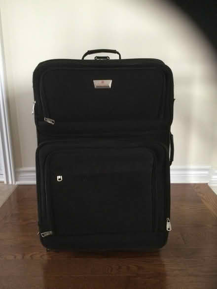 Photo of free 28” black Air Canada suitcase (Stittsville) #1