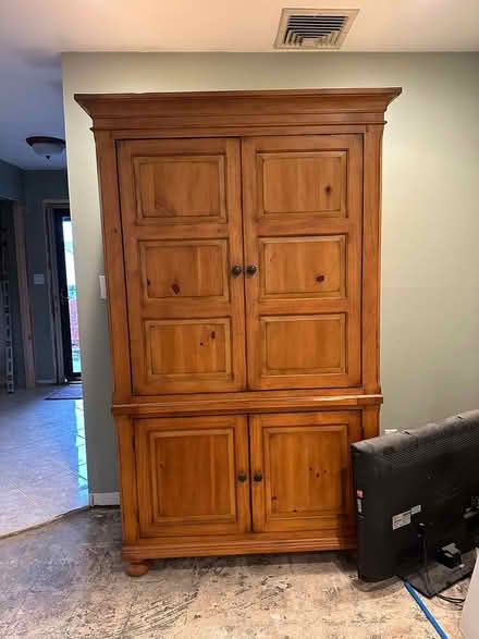 Photo of free Tall wooden tv/storage cabinet (Deer Park NY) #1