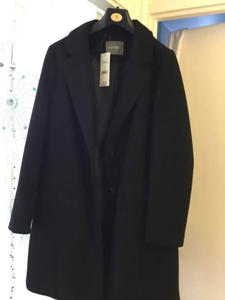 Photo of free Black coat (SG1) #1