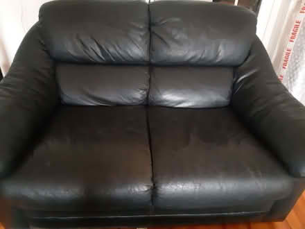 Photo of free Two seater black leather settee (Hereford HR1) #1