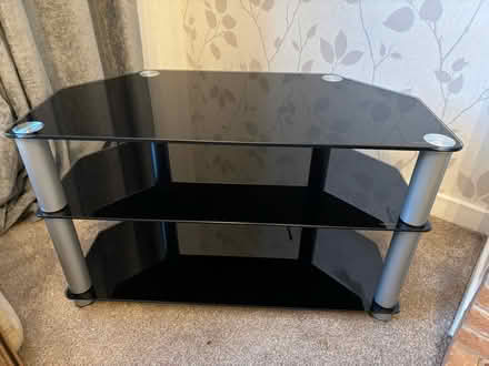 Photo of free Black glass TV unit (Wigston Magna) #1