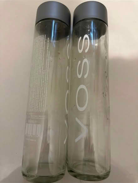 Photo of free X2 large glass empty Voss bottles (CO4 9 Colchester) #1